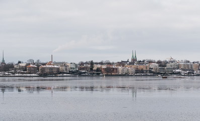 Older apartment houses at the coast of Helsinki Finland on a cold winter day