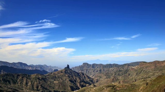 Roque Bentayga view from Mirador de Degollada Becerra, in the background Island of Tenerife and Mount Teide and over all beautiful clouds, Canary Island, time lapse, 4K