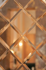 the pattern of mosaic square mirror tiles 