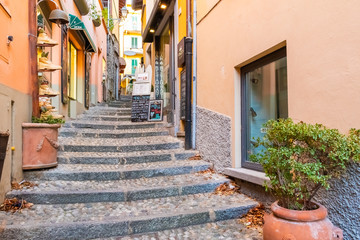 Fototapeta na wymiar Beautiful picturesque and colorful old town street in Bellagio city, Como lake, Italy