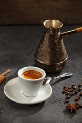 Coffee cup and saucer wooden background