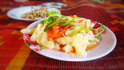 Chicken leg salad.Yum Teen Kai is Thai food.Spicy salty taste. Very delicious.