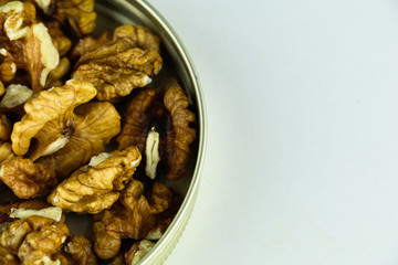 Walnuts in a plate with white background