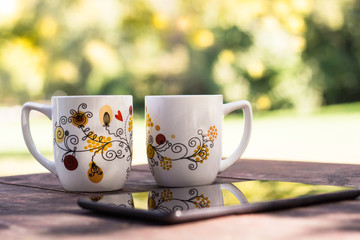 Two Cups and sunny trees 