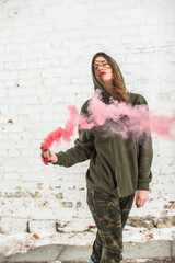 portrait of military girl outdoor of red smoke