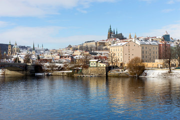 Snowy Prague Lesser Town with Prague Castle above River Vltava, Czech republic