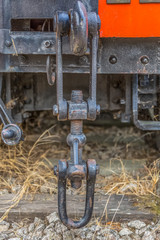 Detailed view of a old wagon stretcher, rusty pieces antique system