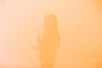portrait of military girl outdoor of orange smoke