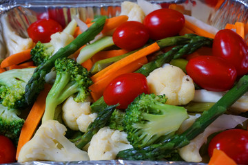 Delicious ceasar salad with bacon lettuce boiled egg tomato cheese ceasar salad dressing parmesan cheese fresh vegetable healthy food in a tray with boiled chicken breast and croutons baked bread