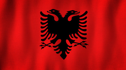 Albania flag waving in the wind. Closeup of realistic Albanian flag with highly detailed fabric texture
