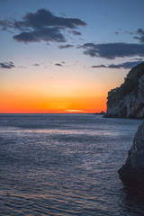Fototapeta na wymiar Beautiful sunset over the cliffs in Petrovac