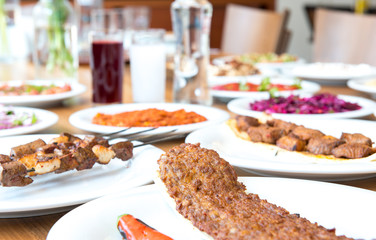 Traditional Turkish Adana Kebab or kebap meat food in Turkish Restaurant with salad