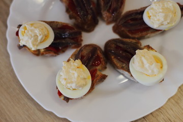 home made spanish traditional snack pintxos with anchovy and egg 