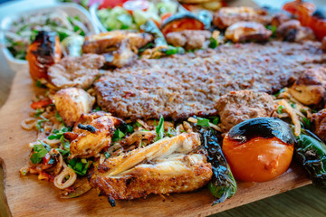 Traditional Turkish Adana Kebab or kebap meat food in Turkish Restaurant with salad