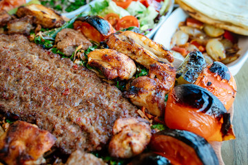 Traditional Turkish Adana Kebab or kebap meat food in Turkish Restaurant with salad