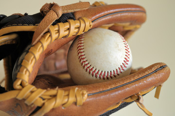 Baseball in leather glove