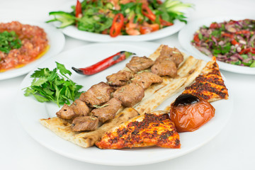 Traditional Turkish Adana Kebab or kebap meat food in Turkish Restaurant with salad