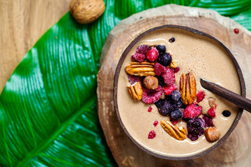 Chocolate smoothie with frozen berries and nuts