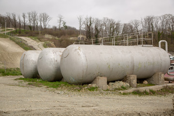 three cisterns in the street in the summer