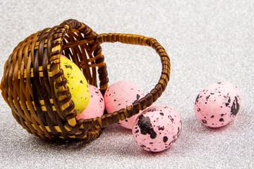 easter abstract gift card on silver colored textured background with easter eggs  laying wicker basket