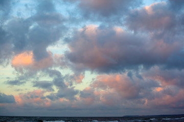 beautiful sunset view over the sea with bright colorful clouds