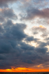 beautiful sunset view over the sea with bright colorful clouds