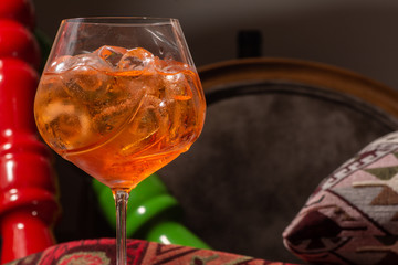 Two glasses of Italian Aperol Spritz alcohol cocktail with ice and blood orange slices selective focus, copy space, Summer refreshing cocktail drink with orange