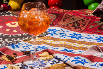 Two glasses of Italian Aperol Spritz alcohol cocktail with ice and blood orange slices selective focus, copy space, Summer refreshing cocktail drink with orange