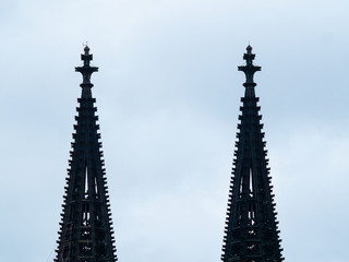 Cologne Cathedral with scaffold against cloudy sky