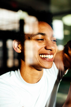 Portrait Of A Young Man Looking Out The Window