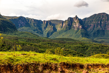 Naklejka premium View of the walls of the Espraiado Canyon from the Road of Corvo Branco, with dense forest ahead, Airue, Santa Catarina, Brazil