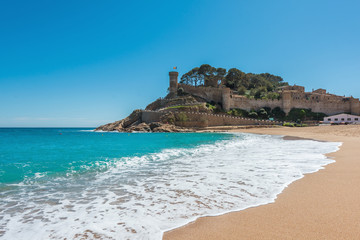 Fototapeta na wymiar Beach at Tossa de Mar and fortress in a beautiful summer day, Costa Brava, Catalonia, Spain
