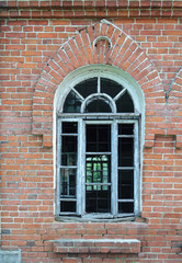 Fototapeta na wymiar Window of old brick building