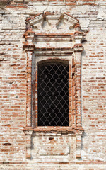 Fototapeta na wymiar Window of old abandoned church