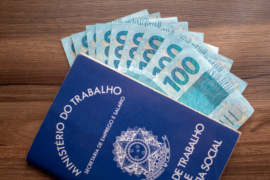 Brazilian document work and social security ( Carteira de Trabalho e Previdencia Social) with brazilian money