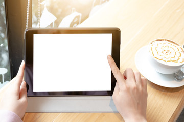 hand showing digital tablet  blank screen on work desk