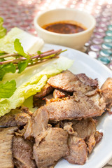 Grilled brisket beef on plate (Thai style)