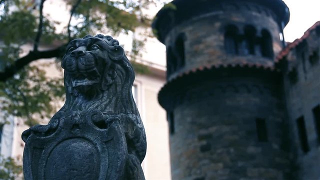 Lion of Judah Sculpture on a Gravestone and the Jewish Ceremonial Hall, Josefov, Prague, Czech Republic. Close Up.  