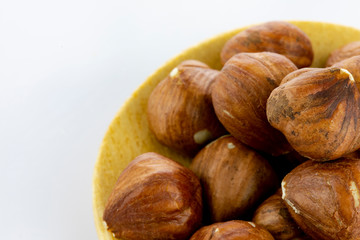 raw hazelnuts isolated on white background