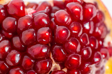 open pomegranate on a white background