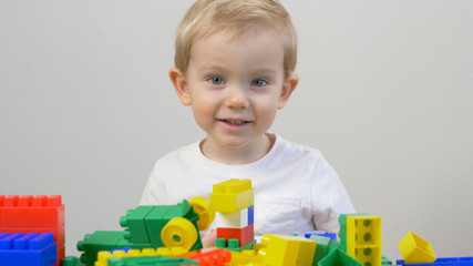 Cute little boy is playing with Building bricks. Educational  Building Blocks for babies kids....