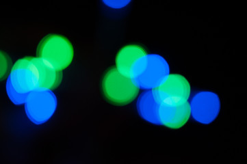 Blurred background, bright colored light bulbs, lights, the light from the garland.