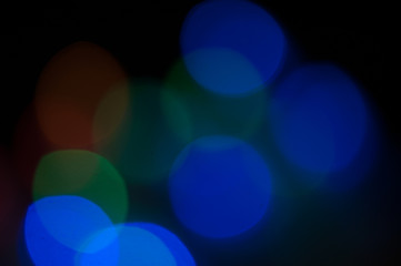 Blurred background, bright colored light bulbs, lights, the light from the garland.