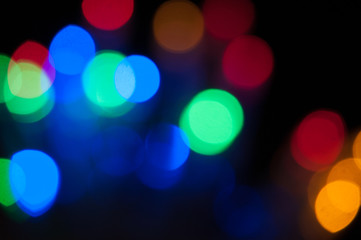 Fototapeta premium Blurred background, bright colored light bulbs, lights, the light from the garland.