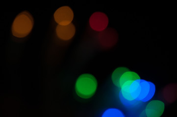 Blurred background, bright colored light bulbs, lights, the light from the garland.