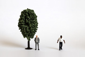 Miniature tree and miniature people.