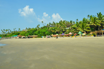 Goa, India - NOVEMBER 2018: Houses and huts on the Vagator beach