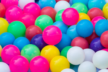 Fototapeta na wymiar Colourful small plastic ball in the playground