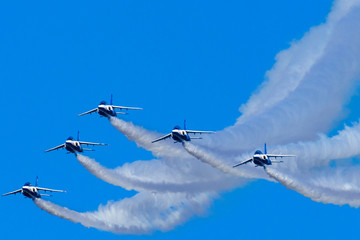 Blue Sky and team flying by Five Jets