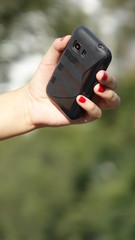 Female Hand Holding Phone Device